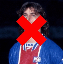 a man wearing a psg jersey with an x crossed over his face