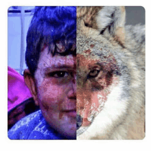 a man with blood on his face is next to a wolf