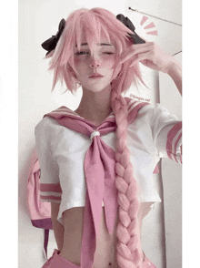 a girl with pink hair is wearing a sailor top