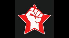 a red star with a fist inside of it on a black background .