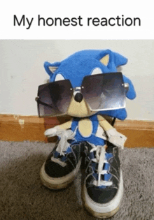 a sonic the hedgehog stuffed animal wearing sunglasses and shoes