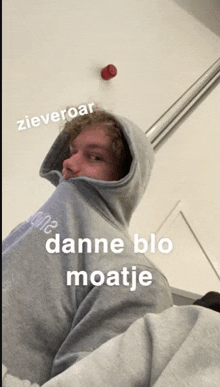 a man wearing a hoodie with the word danne blo on it