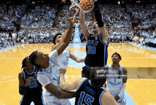 a duke basketball player goes up for a shot