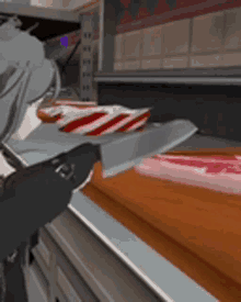 a person is holding a knife over a piece of meat on a counter .