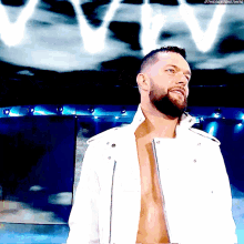 a man with a beard is wearing a white jacket and standing in front of a blue background with the words " the next big thing "