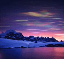 a painting of a sunset over a snowy mountain range