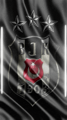 a black and white logo for bjk 1903 with three stars