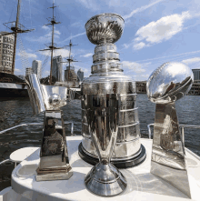 several trophies on a boat one of which says american champions