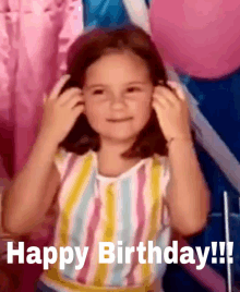 a little girl is wearing a striped shirt and says happy birthday !!