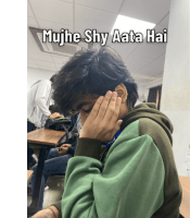 a young man covering his face with his hand with the caption mujhe shy aata hai