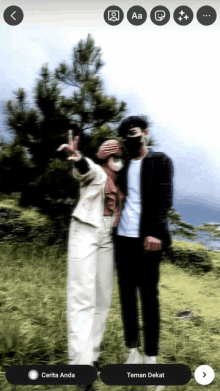 a man and a woman standing next to each other in a field with the words cerita anda at the bottom