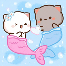 a couple of cartoon cats with mermaid tails