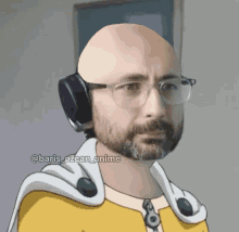 a bald man with glasses and a beard is wearing headphones and a yellow cape