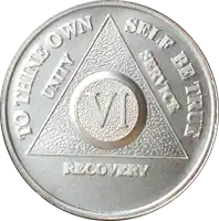 a silver coin that says to think own self be true and unity