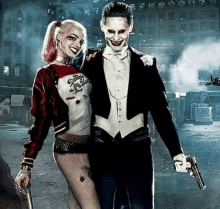 a man and a woman dressed as the joker and harley quinn are holding guns .