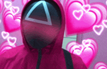 a person in a squid game costume with a triangle on their face surrounded by pink hearts .