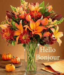 a bouquet of flowers in a vase with the words hello bonjour on it