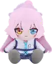 a stuffed toy of a girl with pink hair and blue eyes is sitting on a white surface .