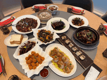 a table topped with plates of food and a receipt that says ' hong kong ' on it