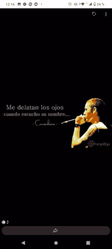 a man is singing into a microphone on a black background with a quote in spanish .