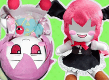 two stuffed dolls with pink hair and red eyes