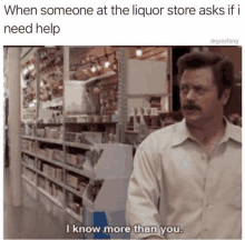 a man with a mustache is standing in front of a liquor store and says i know more than you .