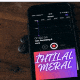 a cell phone displays a new recording of initial meral