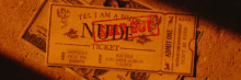 a ticket that says yes i am a nude ticket