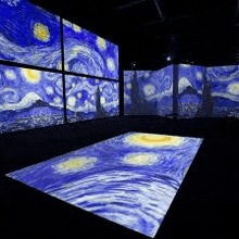 a room with a starry night painting projected on the wall and floor .