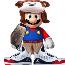 a stuffed mario wearing a monkey hat and supreme pants