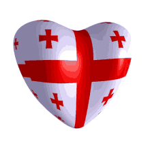 a heart shaped object with a red cross and white crosses on it