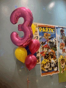 a pink number 3 balloon is surrounded by other balloons and a paw patrol poster