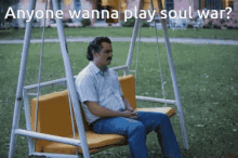 a man is sitting on a swing with the words anyone wanna play soul war