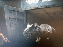 a dinosaur is standing in front of a door that says ' a ' on it