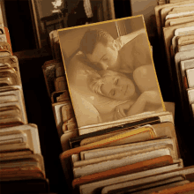 a picture of a man kissing a woman on the forehead is surrounded by other pictures