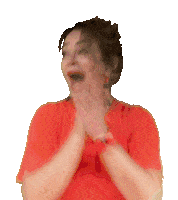 a woman in a red shirt is covering her face with her hands