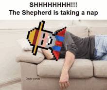 a man is laying on a couch with a pixel art shepherd taking a nap .