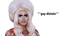 a picture of a drag queen with the words " gay distain " written below her