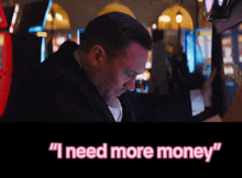 a man in a suit is playing a slot machine and the words " i need more money " are above him