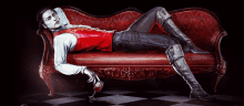 a vampire is laying on a red couch holding a glass of blood