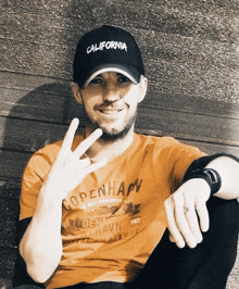 a man wearing a california hat and a copenhagen shirt