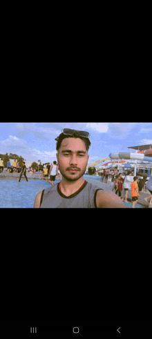 a man is taking a picture of himself in front of a water park