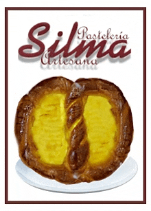 a pastry on a white plate with the name silma written above it