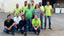 a group of people posing for a picture with one man wearing a name tag that says ' a '