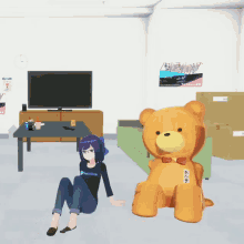 a girl wearing a hololive shirt sits next to a large teddy bear