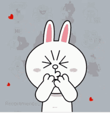 a cartoon of a bunny holding a heart with hearts surrounding it