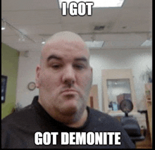 a bald man in a barber shop with the caption " i got demonite " on his face