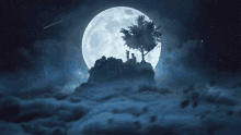 a full moon is behind a tree on a rock