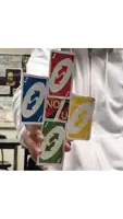 a person is holding a stack of uno cards in their hands