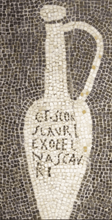 a mosaic of a bottle with the word excel written in black